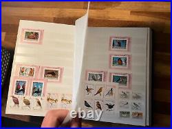 BIRDS ON STAMPS large stockbook 45 sides mint and used 2