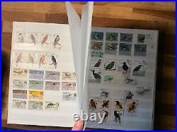 BIRDS ON STAMPS large stockbook 45 sides mint and used 2